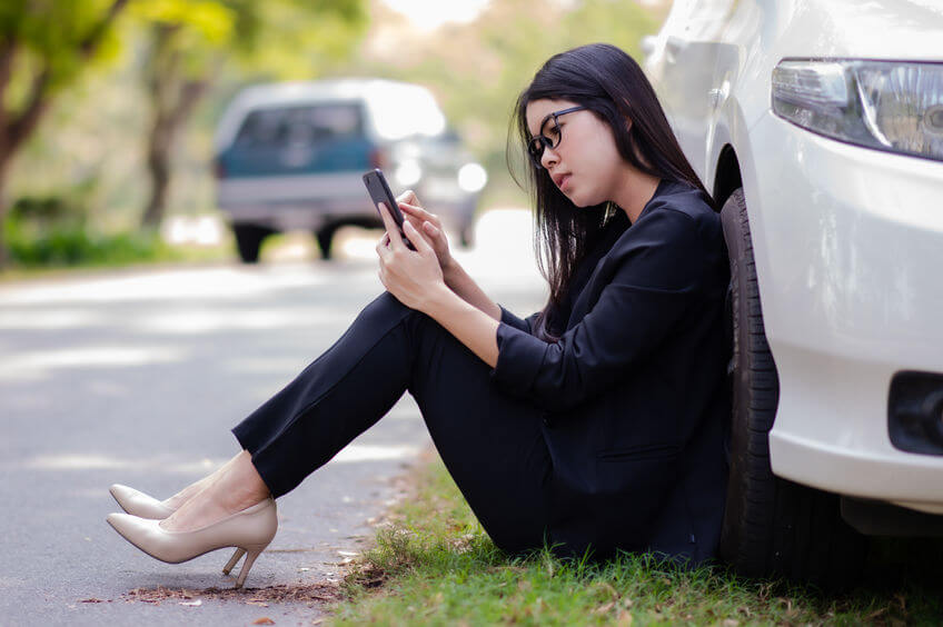 women waiting on side of road for mobile auto mechanic